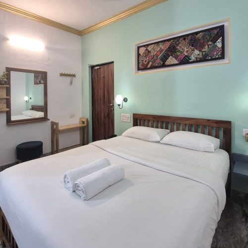 Neat and affordable hotel room in North Goa with modern amenities