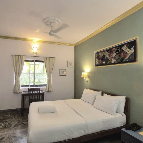 "Prestige room at Laliguras Villa Candolim with private balcony and modern amenities"