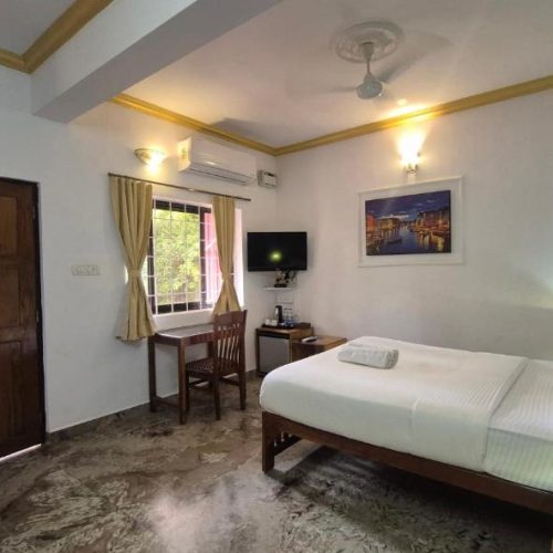 Spacious hotel room with private balcony near Candolim Beach